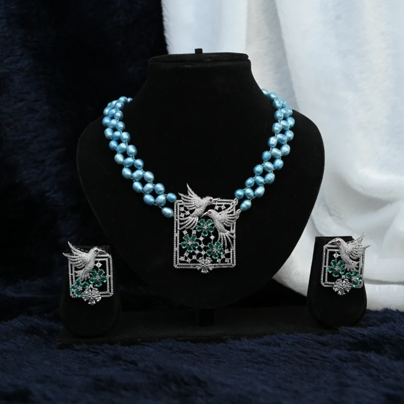 Azure Pearl Harmony Necklace with Bird & Floral Motif Pendant