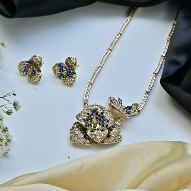 Blue Sapphire and Diamond Flower Necklace with Butterfly Pendant