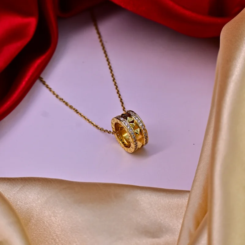Gold Dual-Ring Pendant with Pyramid Studs and Crystal Borders - Image 5