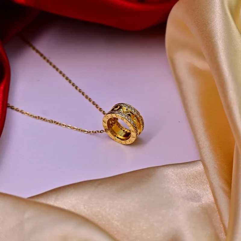 Gold Dual-Ring Pendant with Pyramid Studs and Crystal Borders - Image 3
