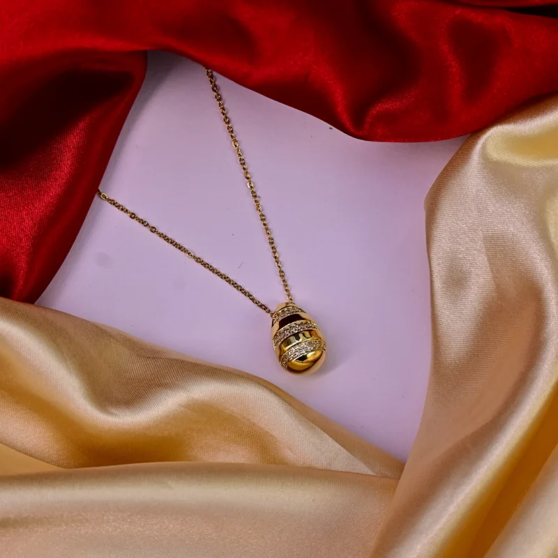 Gold Striped Egg Pendant with Crystal Embellishments - Image 3