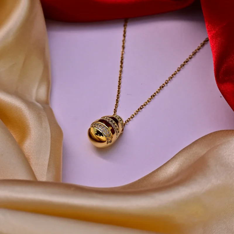 Gold Striped Egg Pendant with Crystal Embellishments - Image 4