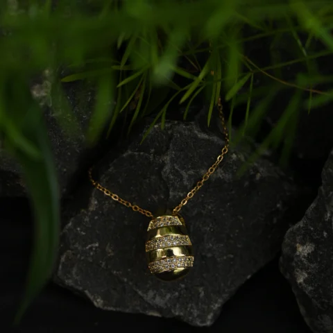 Gold Striped Egg Pendant with Crystal Embellishments